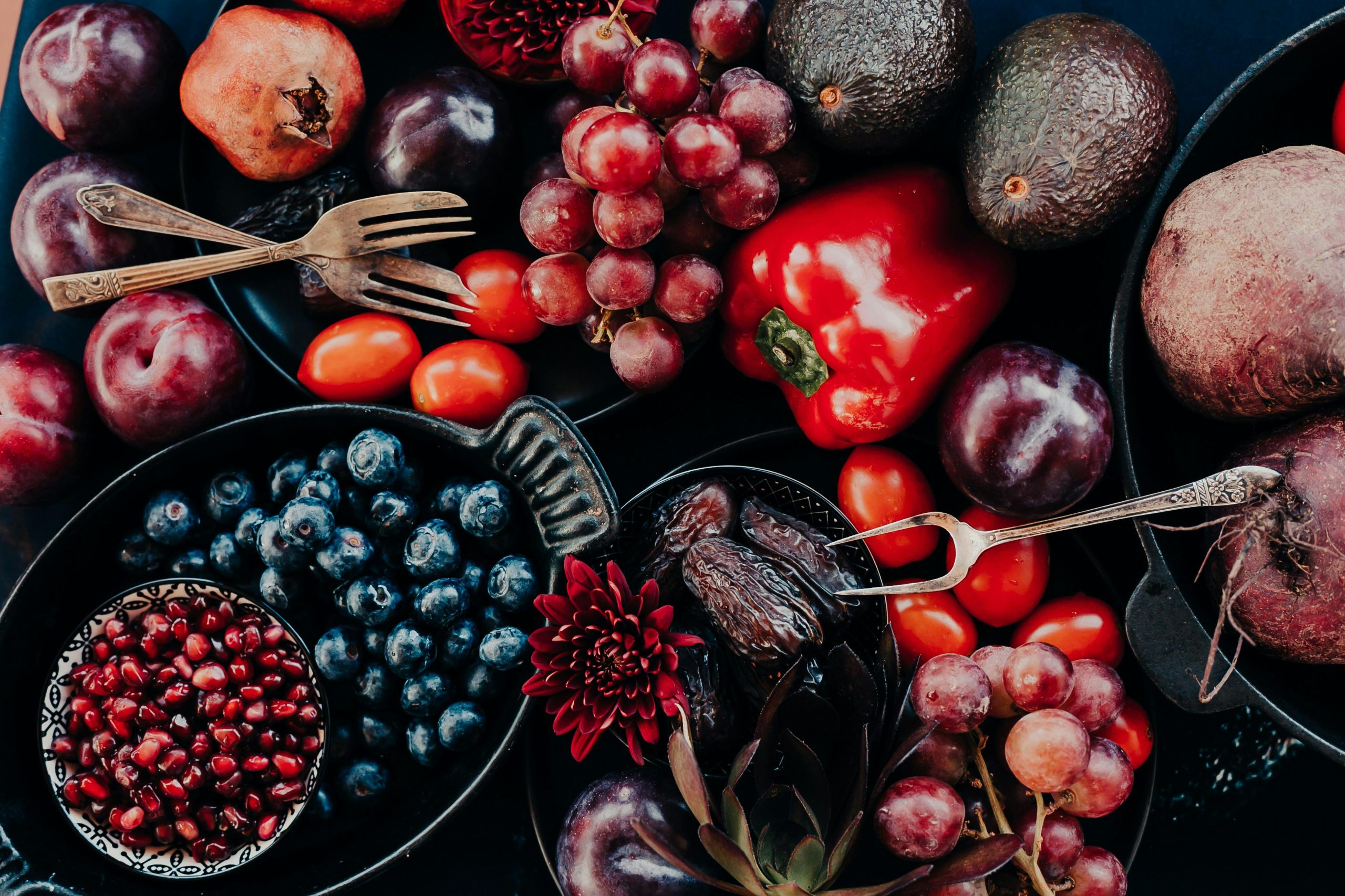 Colorful assortment of fresh fruits and vegetables in a flat lay arrangement, perfect for healthy lifestyle themes.